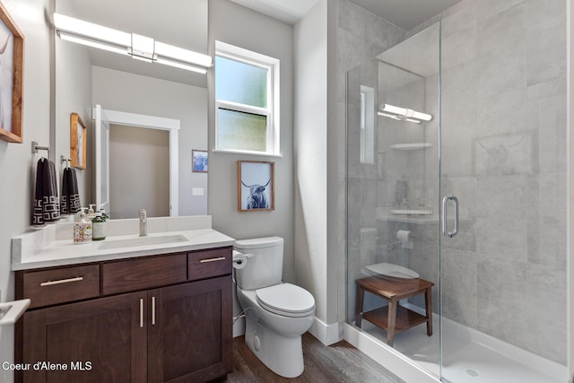 838 N Government Way, Coeur Dalene, ID 83814 - bathroom with wood finished floors, vanity, and a stall shower