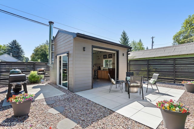838 N Government Way, Coeur Dalene, ID 83814 - view of patio / terrace featuring an outbuilding