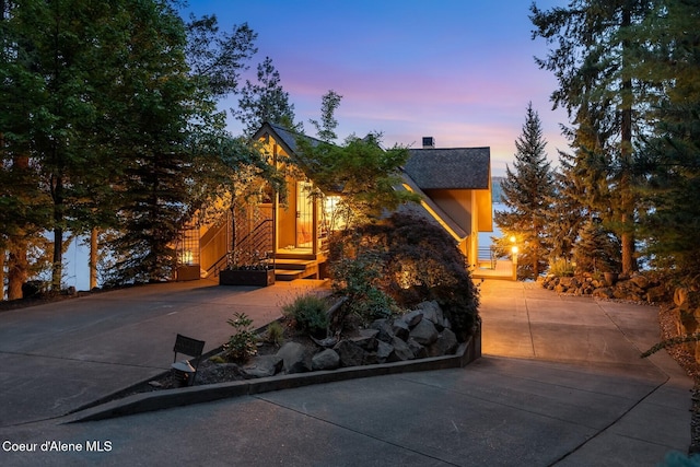 1750 W Valhalla Rd, Coeur Dalene, ID 83814 - view of front of home featuring roof with shingles and concrete driveway