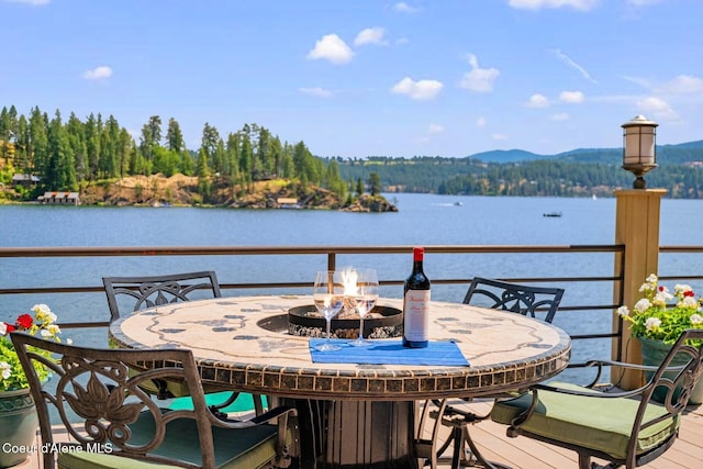 1750 W Valhalla Rd, Coeur Dalene, ID 83814 - balcony featuring an outdoor fire pit, a water view, and outdoor dining area