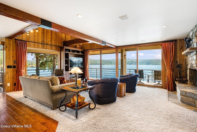 1750 W Valhalla Rd, Coeur Dalene, ID 83814 - living room featuring hardwood / wood-style flooring, wooden walls, a fireplace, and beamed ceiling