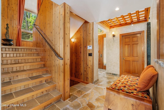 1750 W Valhalla Rd, Coeur Dalene, ID 83814 - stairs featuring stone finish floors, recessed lighting, and wood walls