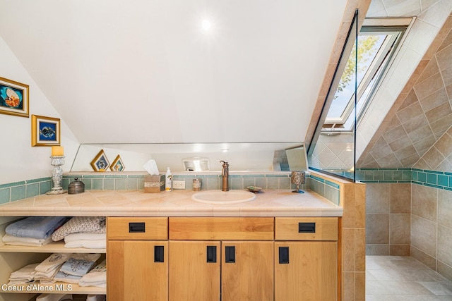 1750 W Valhalla Rd, Coeur Dalene, ID 83814 - bathroom with vanity, a skylight, lofted ceiling, and a walk in shower