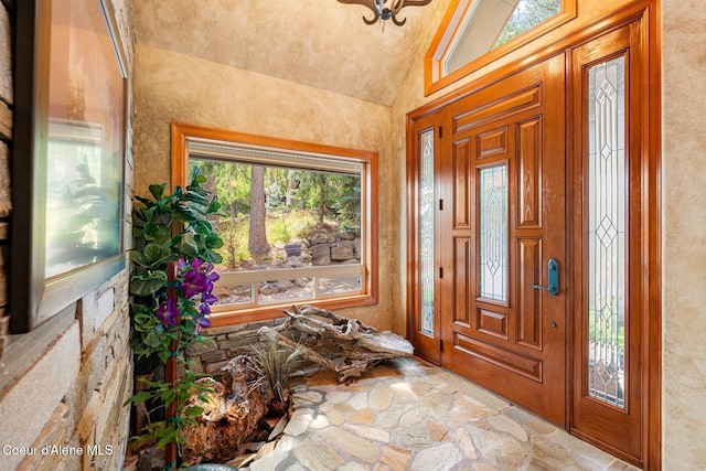 1750 W Valhalla Rd, Coeur Dalene, ID 83814 - entryway featuring stone floors and high vaulted ceiling