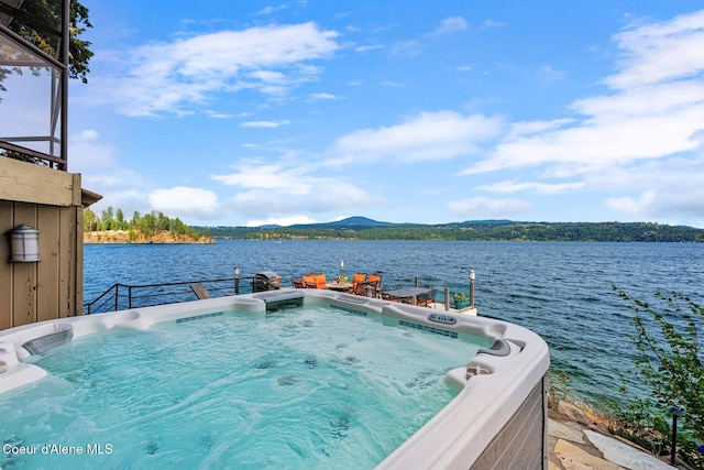 1750 W Valhalla Rd, Coeur Dalene, ID 83814 - dock area featuring a hot tub and a water and mountain view