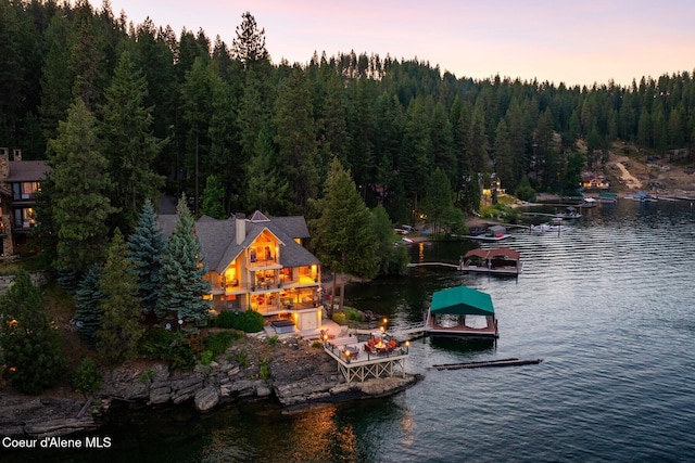 1750 W Valhalla Rd, Coeur Dalene, ID 83814 - water view with a boat dock and a heavily wooded area