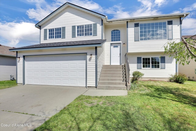 2230 N Methow Ct, Post Falls, ID 83854 - view of front of house with driveway, a garage, and a front yard