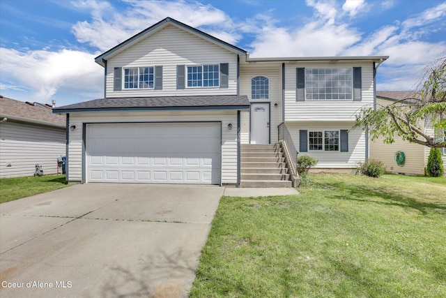 2230 N Methow Ct, Post Falls, ID 83854 - raised ranch with driveway, a front lawn, and a garage