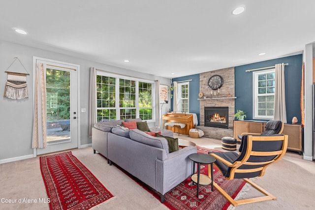 187 White Way, Priest River, ID 83856 - living area featuring carpet flooring, plenty of natural light, a stone fireplace, and recessed lighting