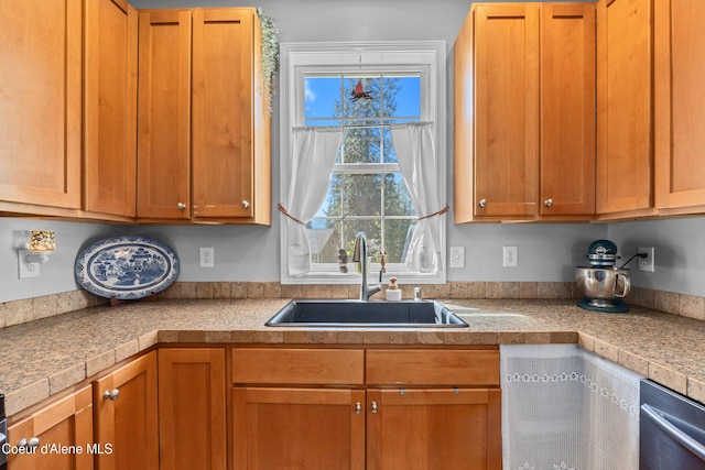 187 White Way, Priest River, ID 83856 - kitchen with brown cabinetry, light countertops, and stainless steel dishwasher