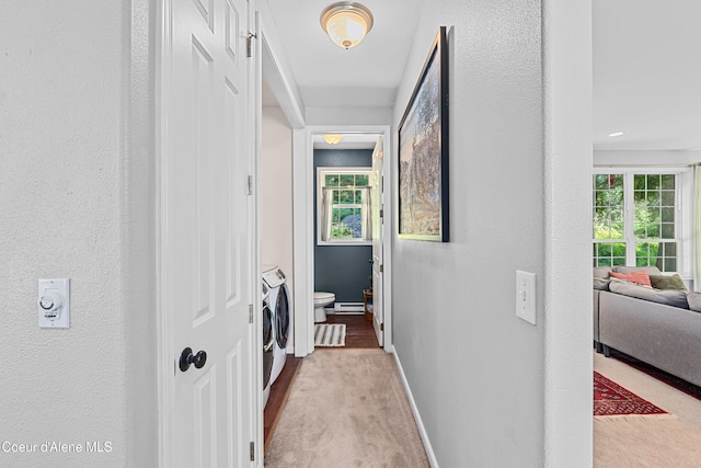 187 White Way, Priest River, ID 83856 - hall featuring washer and clothes dryer, carpet flooring, and a baseboard heating unit