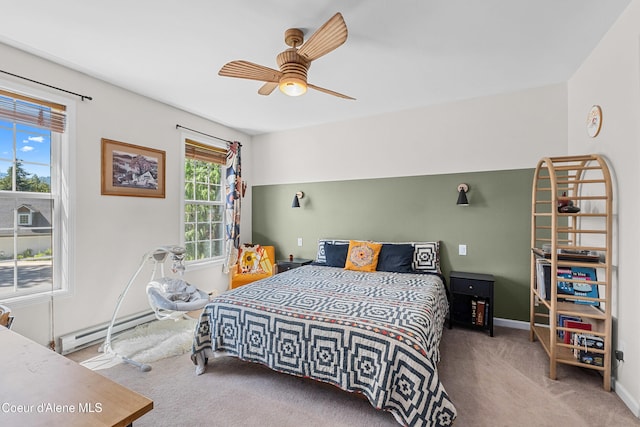 187 White Way, Priest River, ID 83856 - bedroom featuring baseboard heating, carpet floors, and ceiling fan