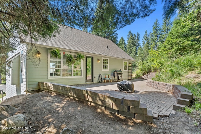 187 White Way, Priest River, ID 83856 - back of house featuring a wooden deck and a shingled roof