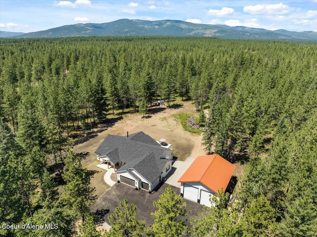 388 Wyatt Ln, Spirit Lake, ID 83869 - drone / aerial view of a forest and a mountainous background