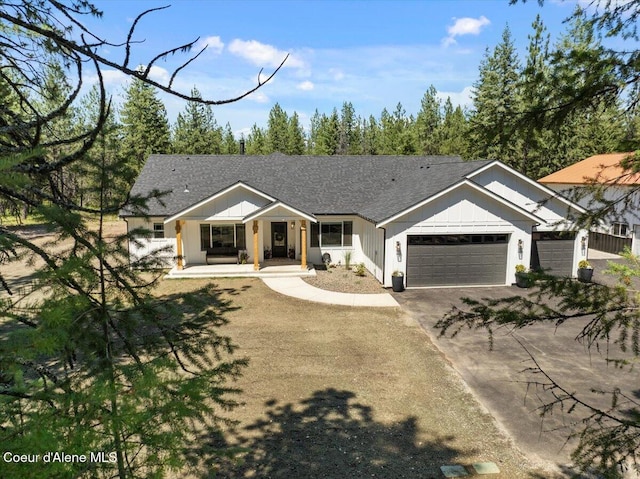 388 Wyatt Ln, Spirit Lake, ID 83869 - ranch-style home featuring an attached garage, driveway, and covered porch