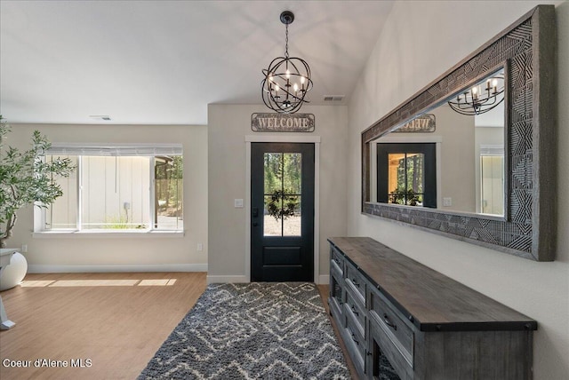 388 Wyatt Ln, Spirit Lake, ID 83869 - entrance foyer with a chandelier and wood finished floors