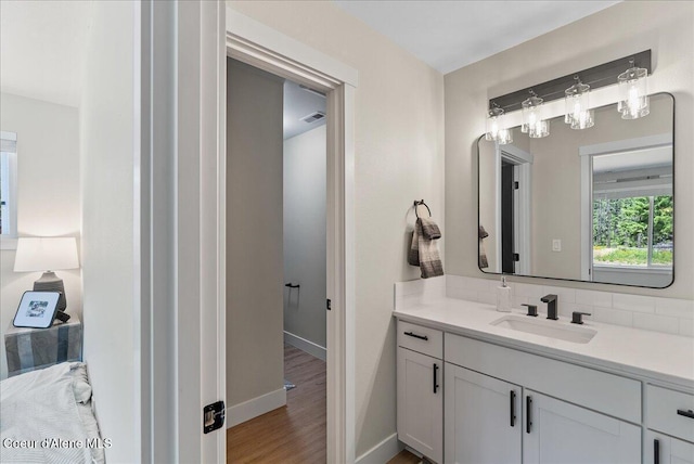 388 Wyatt Ln, Spirit Lake, ID 83869 - bathroom with vanity and wood finished floors