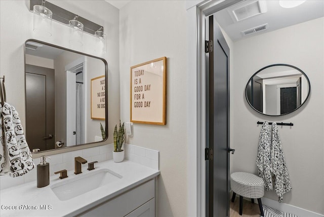 388 Wyatt Ln, Spirit Lake, ID 83869 - bathroom with decorative backsplash and vanity