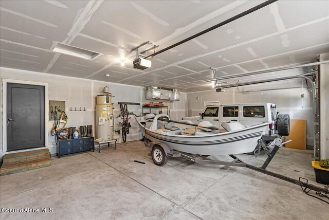 388 Wyatt Ln, Spirit Lake, ID 83869 - garage featuring gas water heater and a garage door opener
