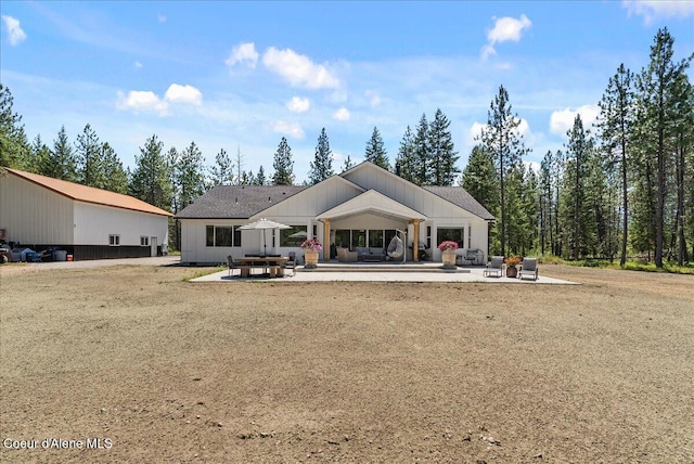 388 Wyatt Ln, Spirit Lake, ID 83869 - rear view of property featuring a patio