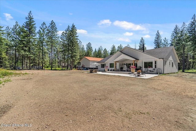 388 Wyatt Ln, Spirit Lake, ID 83869 - rear view of house with a patio