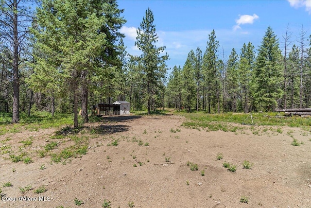 388 Wyatt Ln, Spirit Lake, ID 83869 - view of yard featuring a wooded view