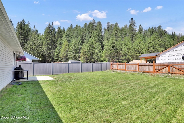 67 Bingham Way, Priest River, ID 83856 - fenced backyard featuring a patio