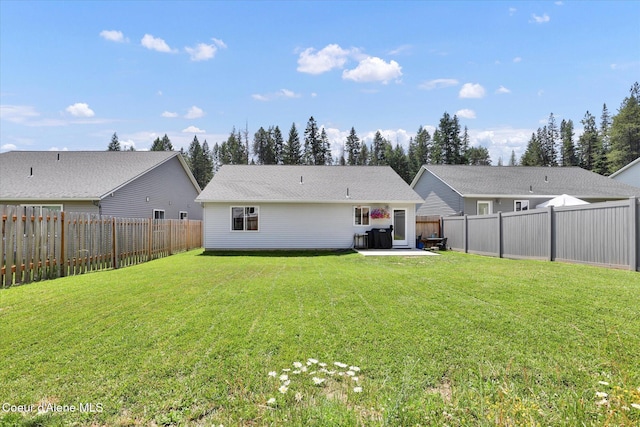 67 Bingham Way, Priest River, ID 83856 - back of property featuring a patio area and a fenced backyard