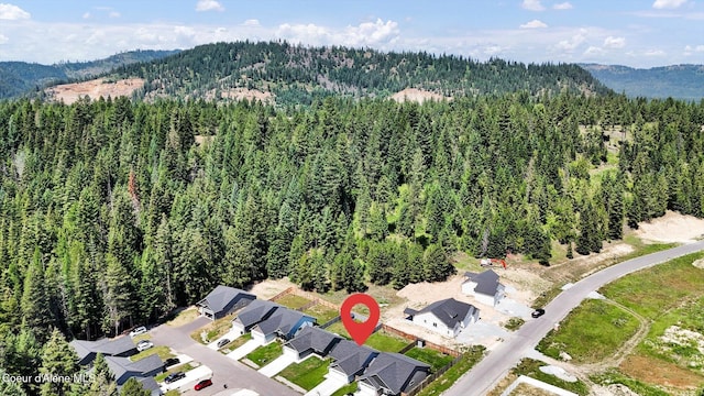 67 Bingham Way, Priest River, ID 83856 - aerial view of property and surrounding area featuring a forest and a mountainous background