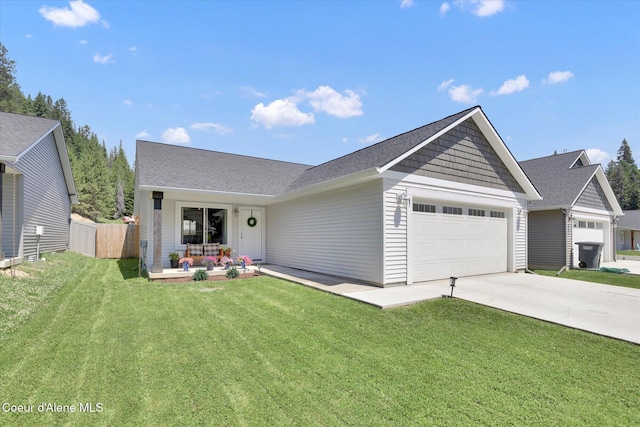 67 Bingham Way, Priest River, ID 83856 - view of front of property featuring a garage, concrete driveway, and roof with shingles