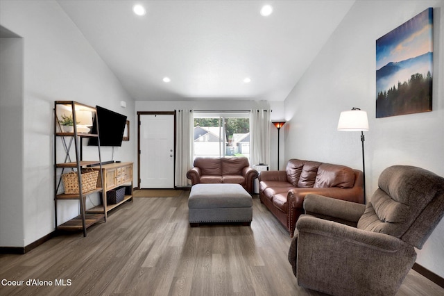67 Bingham Way, Priest River, ID 83856 - living room with lofted ceiling, wood finished floors, and recessed lighting
