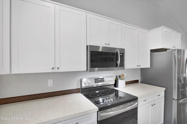 67 Bingham Way, Priest River, ID 83856 - kitchen featuring appliances with stainless steel finishes, light countertops, and white cabinetry