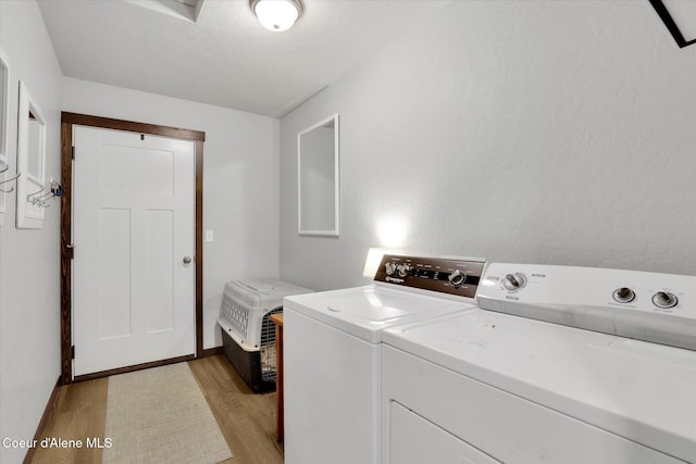 67 Bingham Way, Priest River, ID 83856 - washroom with washing machine and clothes dryer and light wood finished floors