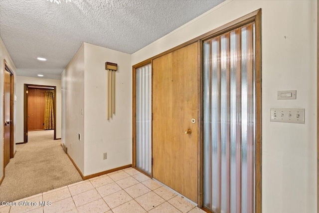 9603 N Strahorn Rd, Hayden Lake, ID 83835 - entryway with a textured ceiling and light colored carpet