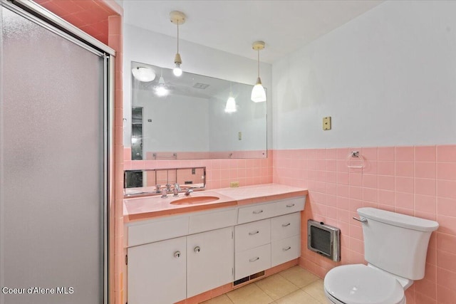 9603 N Strahorn Rd, Hayden Lake, ID 83835 - bathroom with vanity, tile walls, an enclosed shower, and tile patterned floors