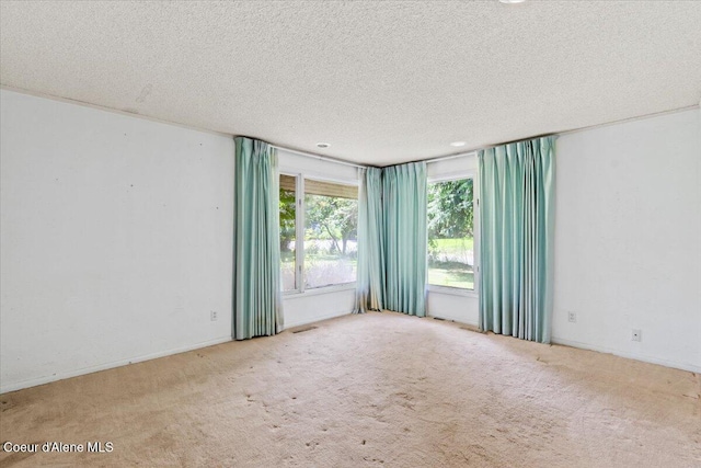 9603 N Strahorn Rd, Hayden Lake, ID 83835 - spare room with a textured ceiling and carpet floors