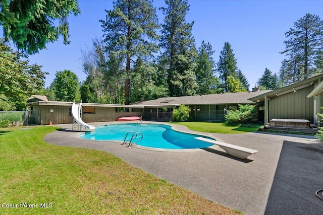 9603 N Strahorn Rd, Hayden Lake, ID 83835 - view of pool featuring a water slide, a diving board, and a patio area