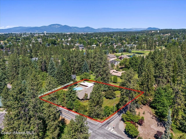 9603 N Strahorn Rd, Hayden Lake, ID 83835 - aerial overview of property's location featuring mountains and property boundaries highlighted