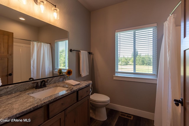 23426 N Massif Rd, Rathdrum, ID 83858 - bathroom featuring vanity, wood finished floors, and curtained shower