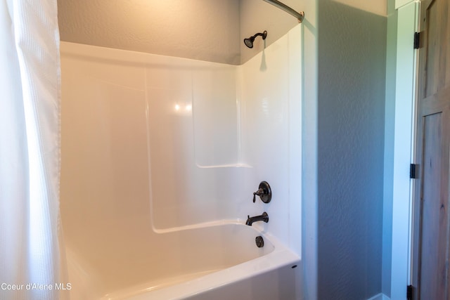 23426 N Massif Rd, Rathdrum, ID 83858 - full bath featuring a textured wall and bathing tub / shower combination