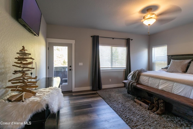23426 N Massif Rd, Rathdrum, ID 83858 - bedroom featuring multiple windows, dark wood-type flooring, and a ceiling fan