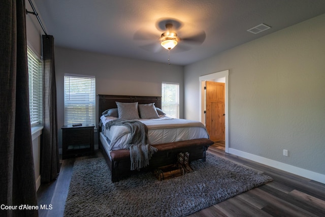 23426 N Massif Rd, Rathdrum, ID 83858 - bedroom featuring multiple windows, wood finished floors, and a ceiling fan