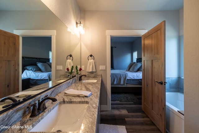 23426 N Massif Rd, Rathdrum, ID 83858 - full bath featuring ensuite bath, wood finished floors, double vanity, and a garden tub