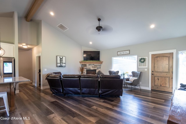 23426 N Massif Rd, Rathdrum, ID 83858 - living area featuring a ceiling fan, a stone fireplace, beamed ceiling, dark wood-style flooring, and recessed lighting