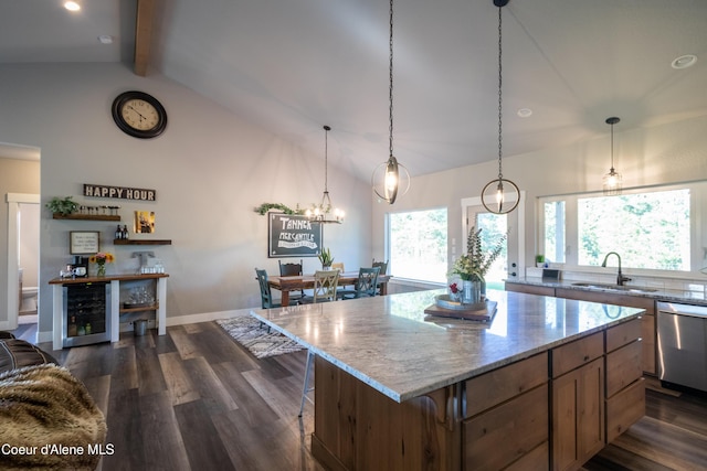 23426 N Massif Rd, Rathdrum, ID 83858 - kitchen featuring wine cooler, dishwasher, beamed ceiling, dark wood finished floors, and light stone counters