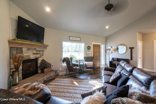 23426 N Massif Rd, Rathdrum, ID 83858 - living room with a stone fireplace, wood finished floors, ceiling fan, recessed lighting, and high vaulted ceiling