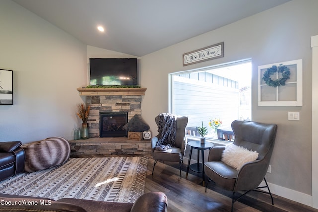 23426 N Massif Rd, Rathdrum, ID 83858 - living area with lofted ceiling, wood finished floors, a fireplace, and recessed lighting