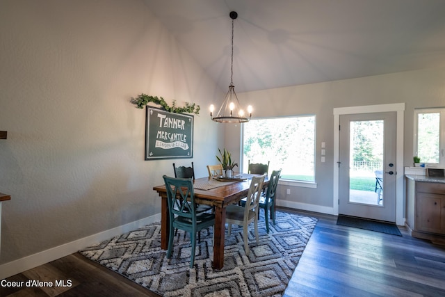23426 N Massif Rd, Rathdrum, ID 83858 - dining space with a chandelier, wood finished floors, and lofted ceiling