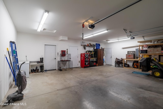 23426 N Massif Rd, Rathdrum, ID 83858 - garage featuring a workshop area and a garage door opener