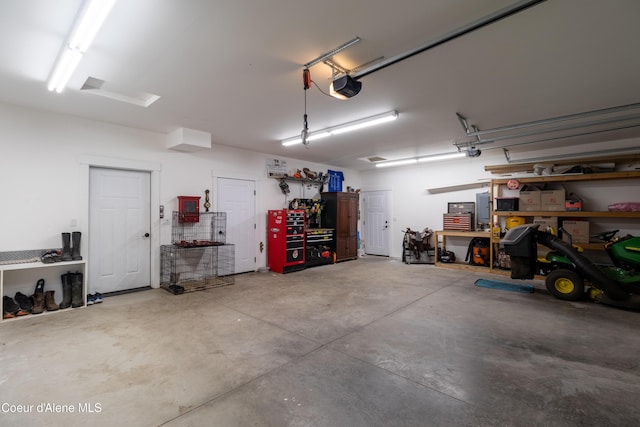 23426 N Massif Rd, Rathdrum, ID 83858 - garage with a workshop area and a garage door opener
